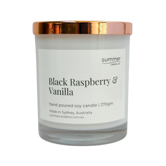 Hand-poured soy wax candle in a white jar with a rose gold lid, scented with Black Raspberry & Vanilla. A sweet, fruity blend of ripe berries and creamy vanilla. Clean-burning and perfect for gifting or adding a touch of indulgence to your space.