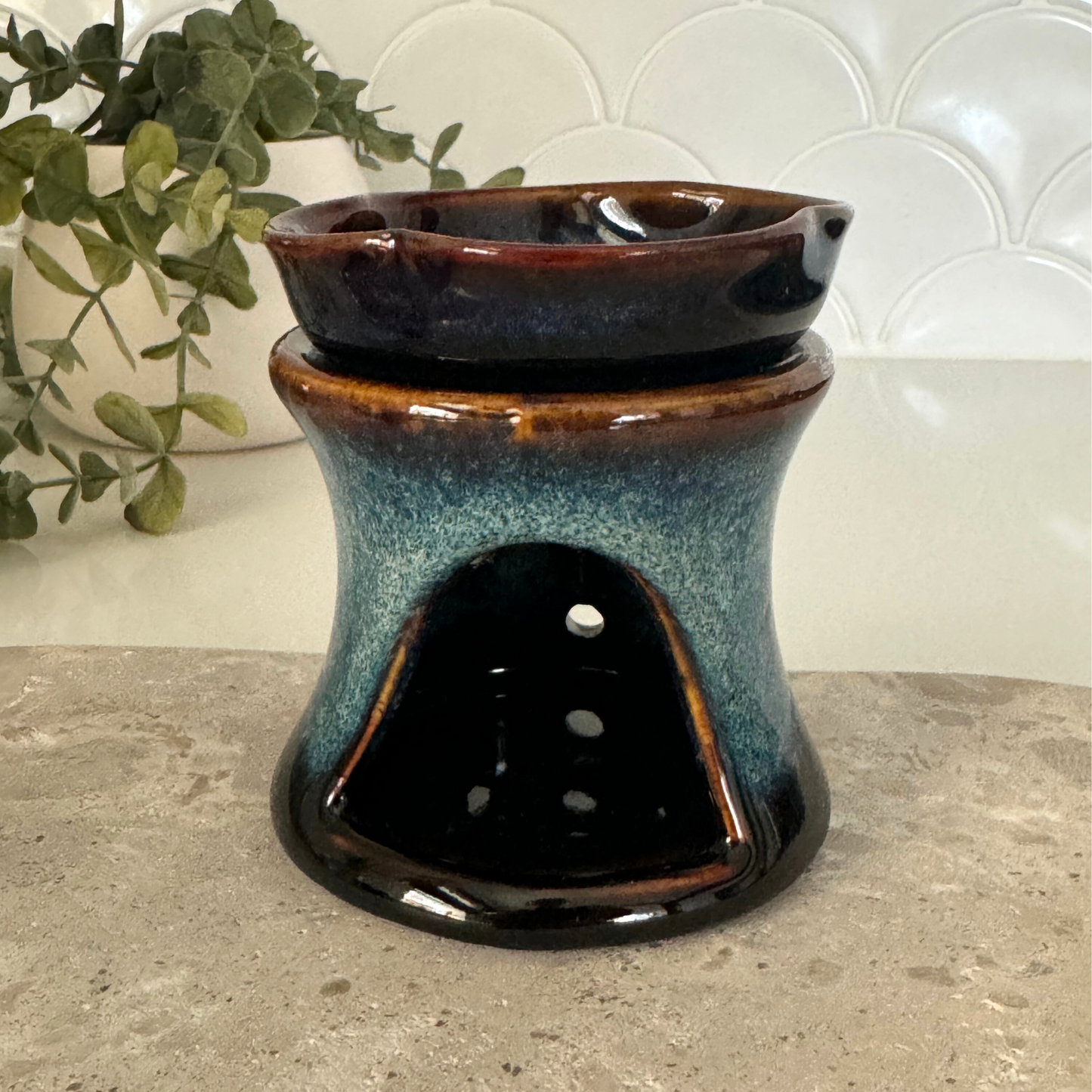 Blue handmade ceramic essential oil diffuser. Removable ceramic tray which holds the oil, with a hole for a tealight to sit inside.