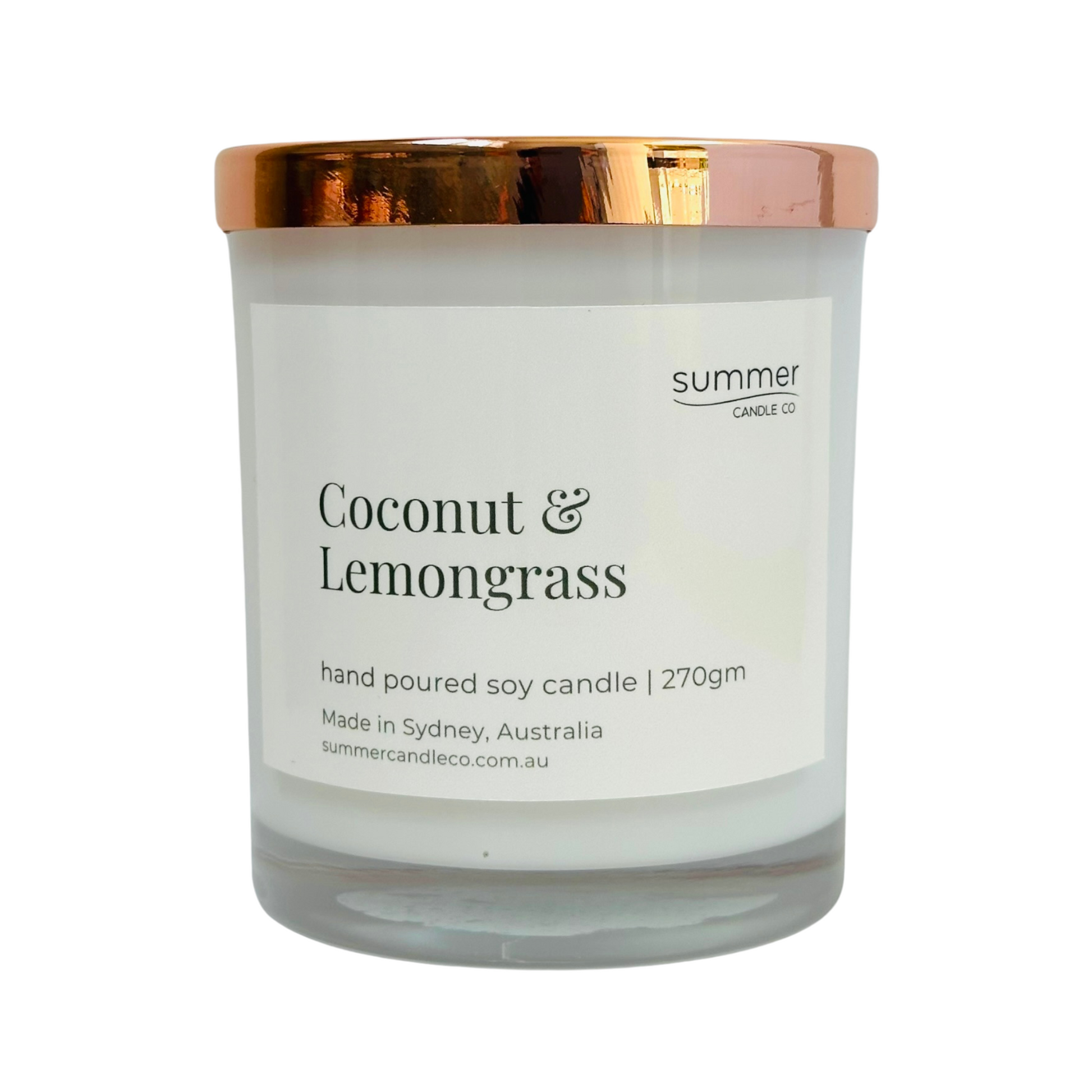 Hand-poured soy wax candle in a white jar with a rose gold lid, scented with Coconut & Lemongrass. A refreshing tropical blend with zesty lemongrass and creamy coconut. Clean-burning and perfect for gifting or creating a bright, energising space.