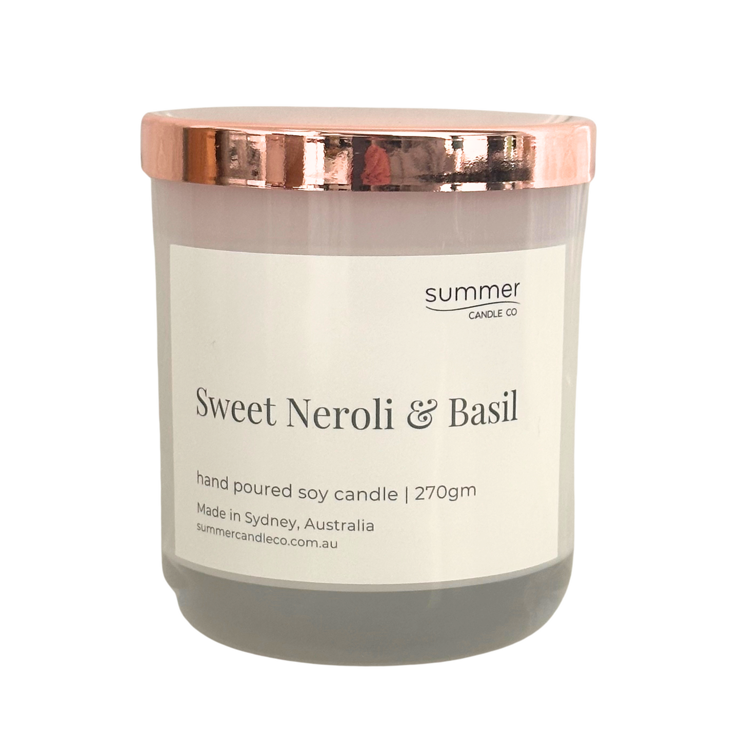 Hand-poured soy wax candle in a white jar with a rose gold lid, scented with Sweet Neroli & Basil. A fresh, uplifting blend of citrusy neroli and herbal basil. Clean-burning and perfect for gifting or creating a bright, refined atmosphere.