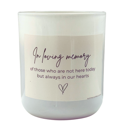 White candle with text 'In Loving Memory of those who are not here today but always in our hearts'