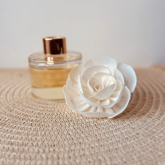 Flower reed diffuser featuring a handcrafted, biodegradable rice paper bloom. Gently absorbs and releases fragrance, offering a long-lasting, flameless scent experience. A beautiful and eco-friendly way to elevate any room with natural charm.